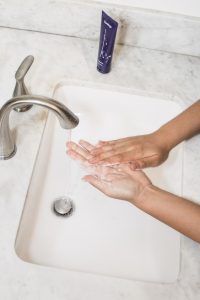 woman washing her hand
